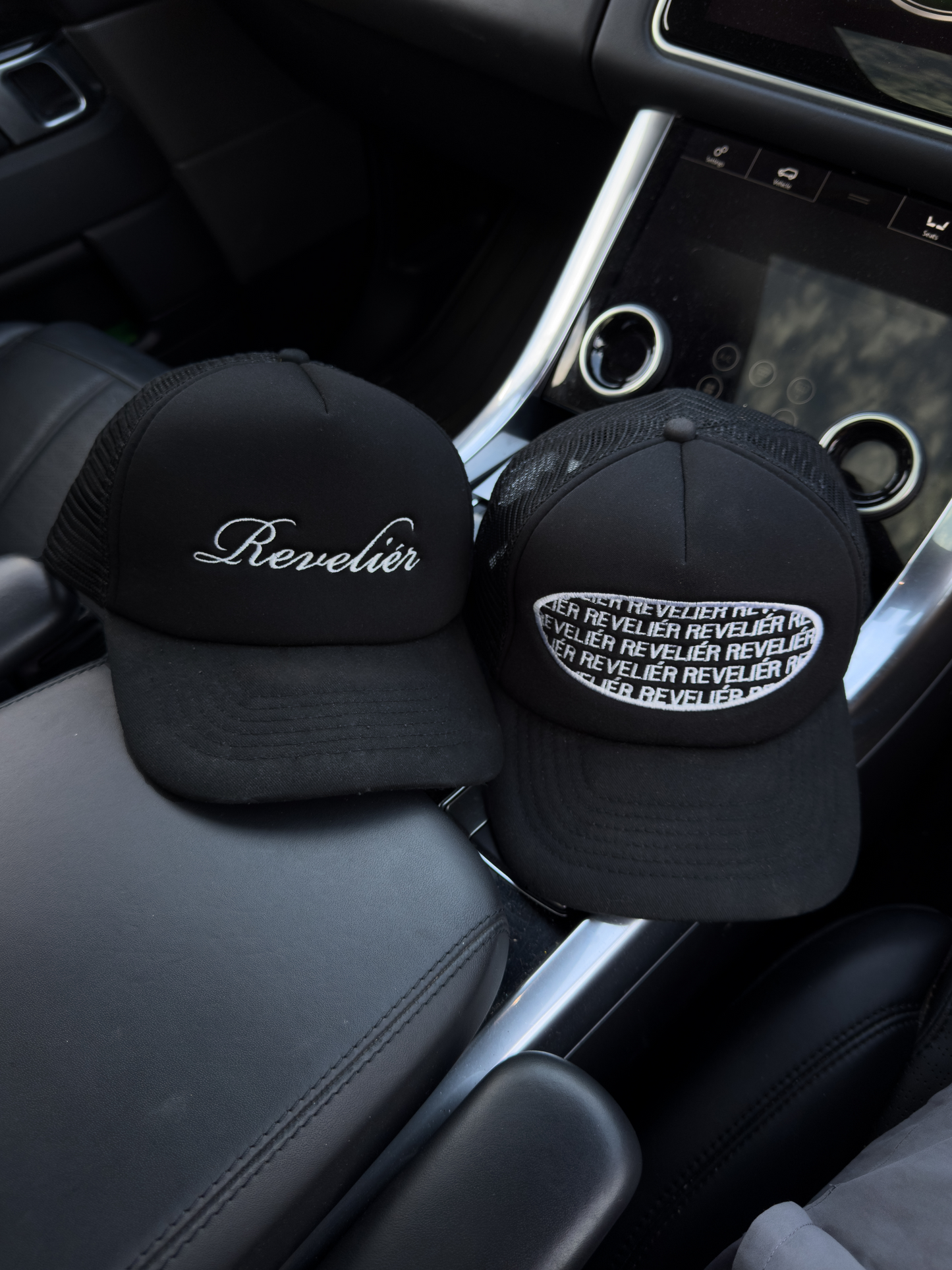 REPEAT LOGO TRUCKER HAT - BLACK